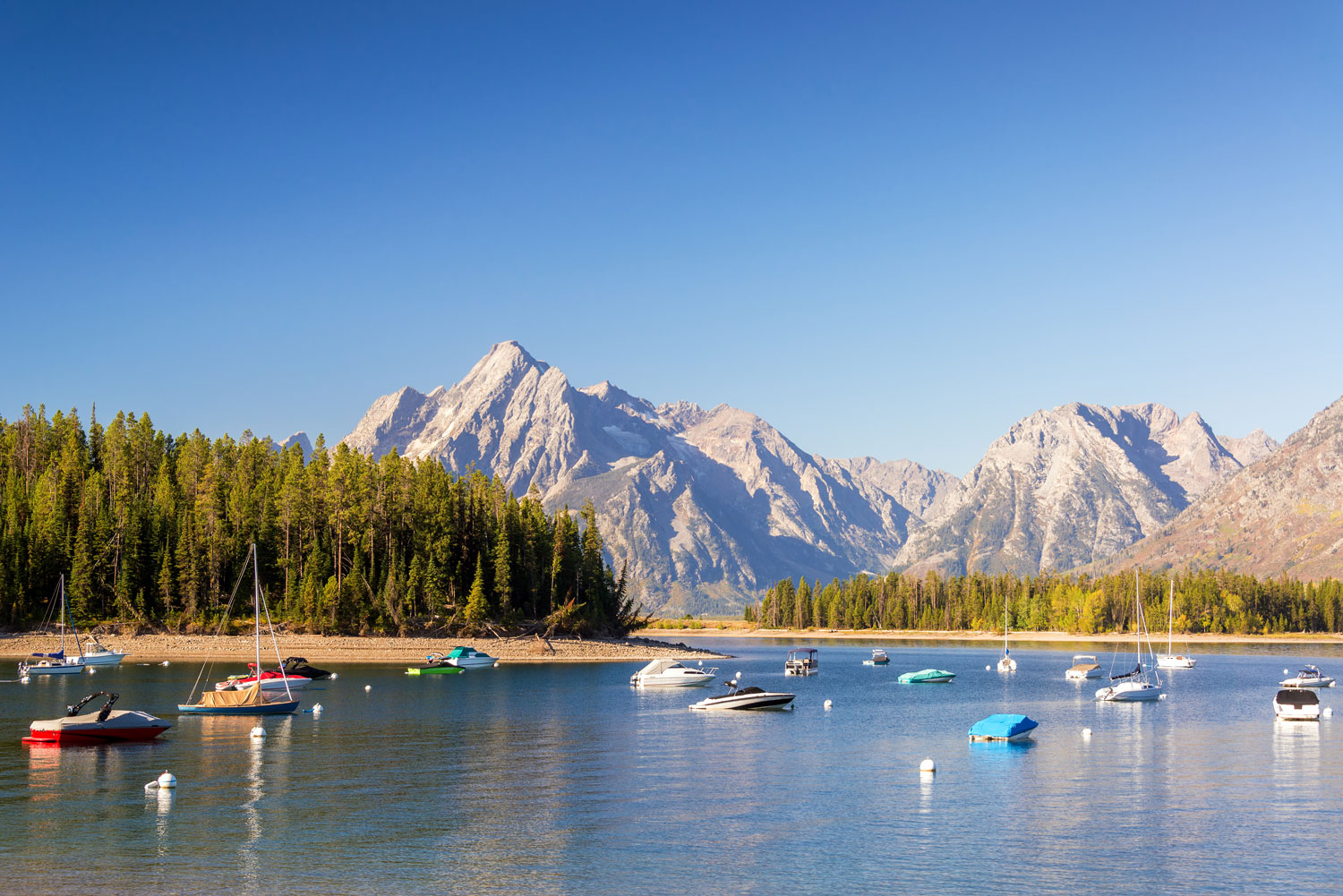 Mountain landscape with lake and forest.